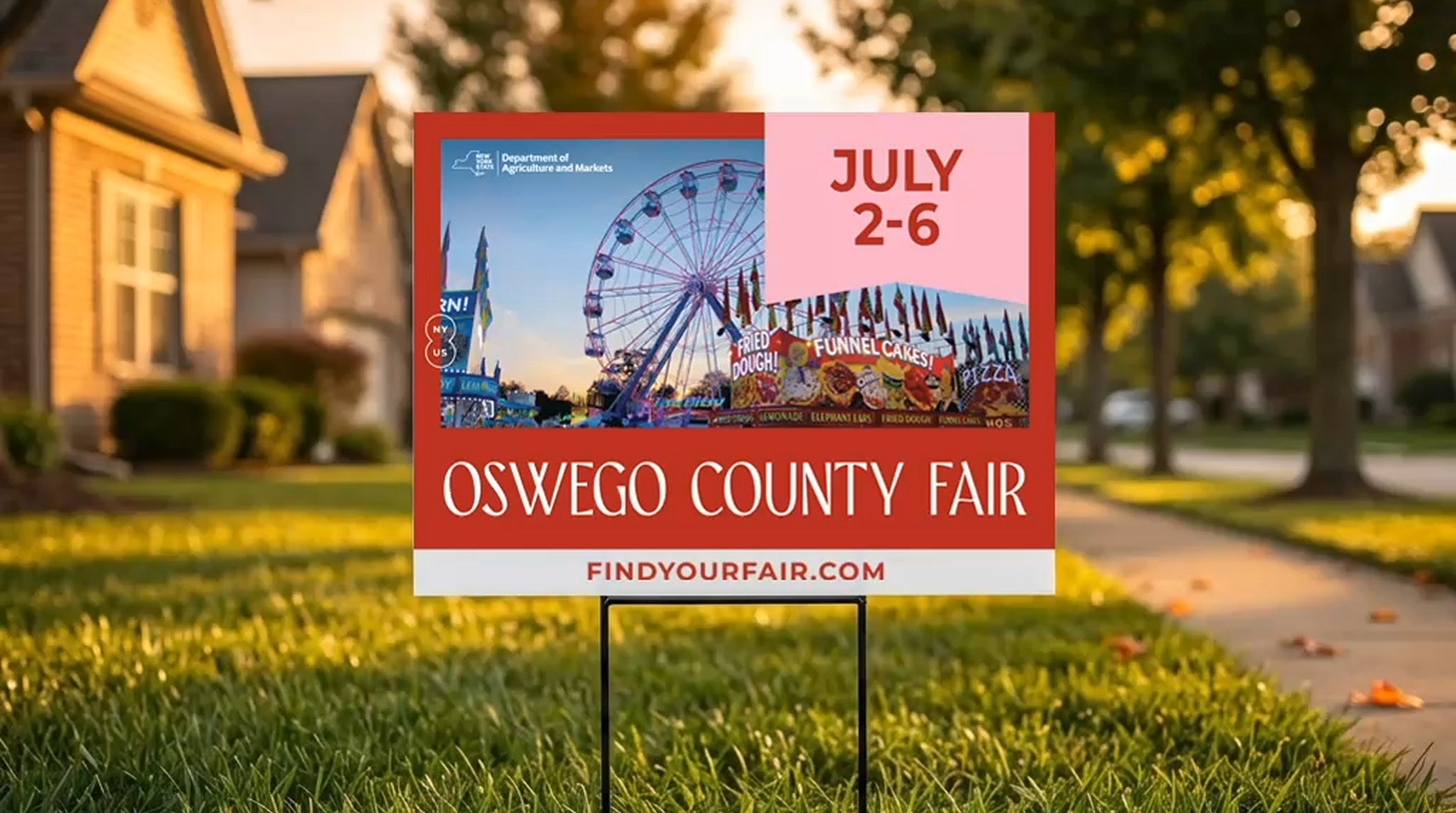 A photograph of a yard sign designed for the 2025 Oswego County Fair