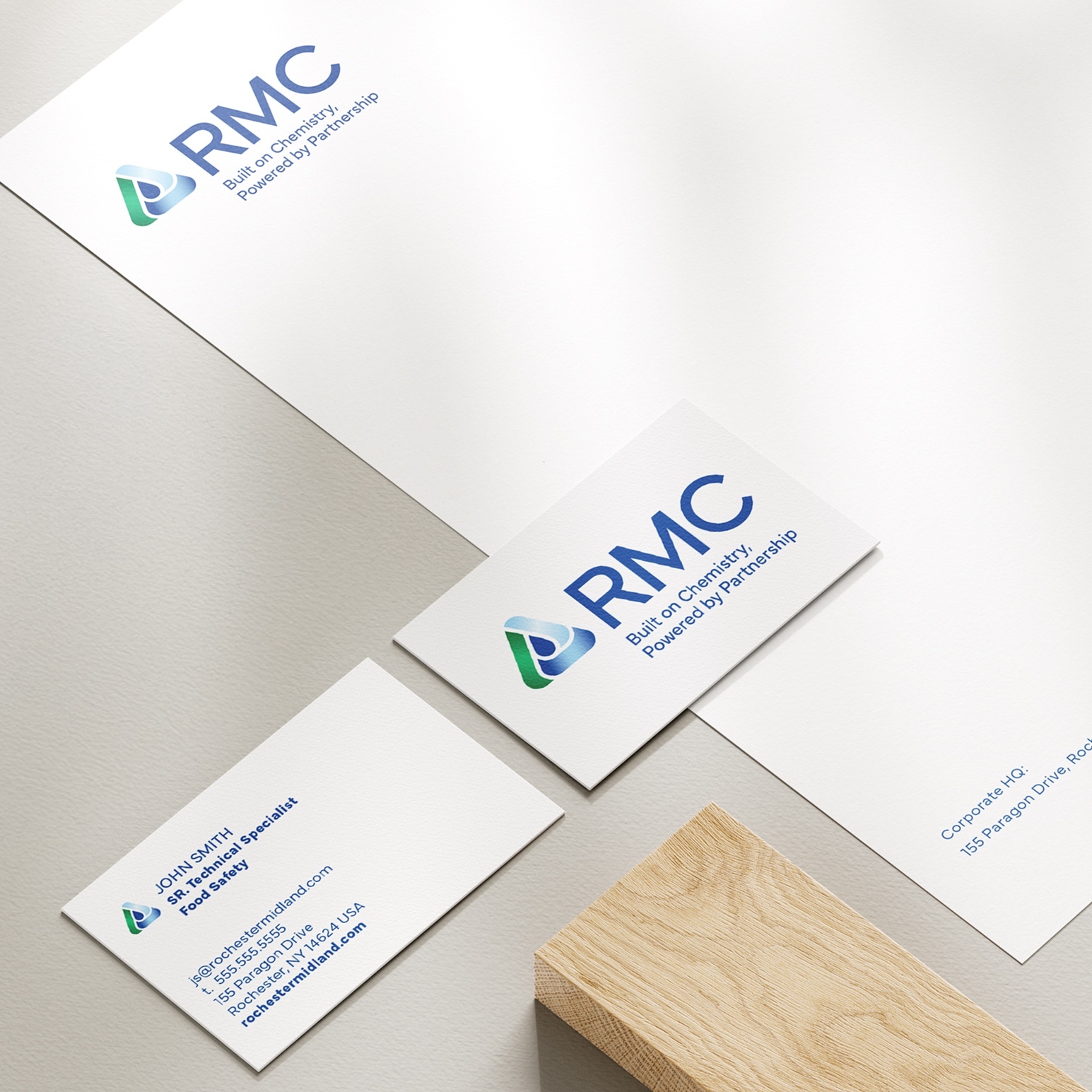 Examples of the new RMC branding applied to letterhead and business cards